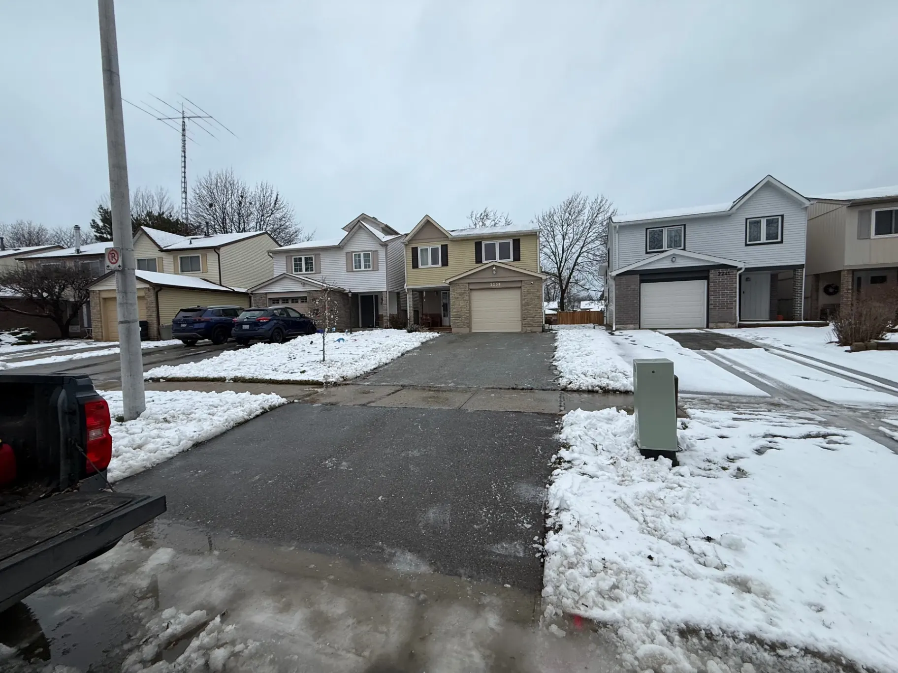 Snow-cleared driveway and street view in Burlington